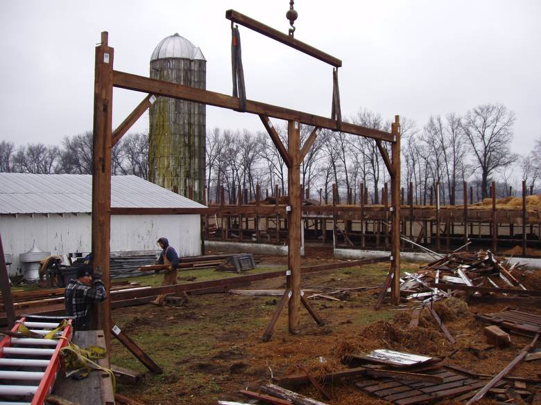 Camp Barn Frame Dismantle / A bent being laid down